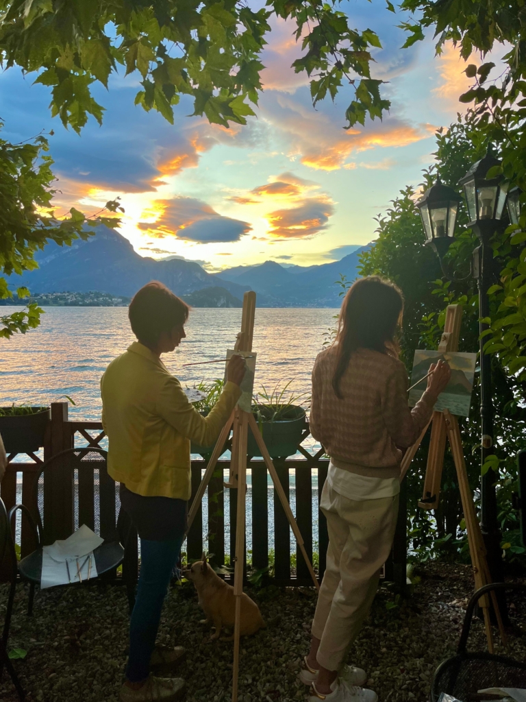 training on the como lake "en plein air" during sunsed with 2 students painting