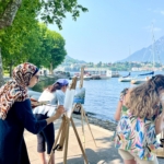 group of painters on the lecco harbour