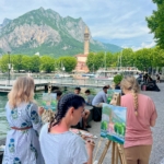 group of painters on the lecco harbour
